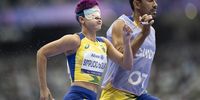 epa11573040 Thalita Vitoria Simplicio da Silva and her guide Felipe Veloso da Silva of Brazil compete during the Women's 400m T11 Qualification of the Para Athletics competitions in the Paris 2024 Paralympic Games, in Paris, France, 30 August 2024.  EPA-EFE/ENNIO LEANZA