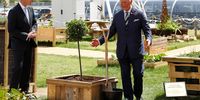Prince Charles reacts next to GCHQ Director Jeremy Fleming after planting a tree in front of the GCHQ headquarters on 12 July 2019 in Cheltenham, England. (Photo: Peter Nicholls / WPA Pool/  Getty Images)