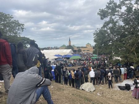 Two hundred documented refugees forced to join thousands camped at community hall