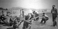 Justice and Cleansing in Iran; 1980 Pulitzer Prize, Spot News Photography, Jahangir Razmi of Ettela'at, Iran; On Aug. 27, in Sanandaj. Nine Kurdiah rebels and two former police officers of the deposed Shah of Iran are tried and sentenced to death. Their execution by firing squad is brutal and quick, documented in startling detail by a photographer from Ettdn'at an Iranian newspaper. To protect the photographer's life, his photo ran without credit in Ettela'at. A UPI staffer in Iran acquired the picture from the newspaper, and it was transmitted worldwide. Explained the UPI staffer: "The photographer later related he was at risk of being shot himself, and smuggled the film in his trouser pocket. Those in the bureau often sat gazing at the picture, and contemplated the numbing transition from life to death that it depicts." The Pulitzer Prize was awarded to "an unnamed photographer," which is how it stayed until 2006 when The Wall Siren Journal conclusively identified the photographer as Jahangir Razmi, who now runs a photo studio in Tehran. "There’s no more reason to hide." Razmi told the Journal (Image: Flickr)