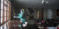 Snow maker Mike Visser opens the blinds in an empty restaurant at the Tiffindell Ski Resort. (Photo: Shiraaz Mohamed)