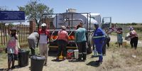 Bronkhorstspruit resident get water from a tanker.