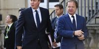 Then British prime minister David Cameron, left, and Hugo Swire, then foreign office minister, arrive at Lancaster House in London, Britain, 12 May 2016. (Photo: EPA / Facundo Arrizabalaga)