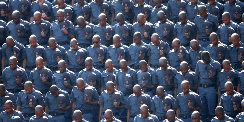 President pays tribute to slain police officers, while public trust in ...