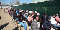 JOHANNESBURG, SOUTH AFRICA - JULY 27: Citizens wait in long queues at Witkoppen vaccination site on July 27, 2021 in Johannesburg, South Africa. It is reported that the health department officially opened the vaccine registration system to allow people aged 35 years and above to register for vaccination. (Photo by Gallo Images/Luba Lesolle)