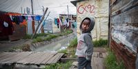 A South African boy walks between shacks in the impoverished shack settlement of Masiphumelele, Cape Town, South Africa, 23 August 2017. According to Statistics South Africa's Poverty Trends Report released by South Africa's Statistician General Pali Lehohla on 22 August 2017 poverty is rapidly increasing in the country. Between the years of 2011 and 2015 there has been an increase of  three million more South Africans living in poverty. Over 30 million South African?s out of the 55 million citizens over this same time period live in poverty or below the upper poverty line of Rands 992 or 63 Euro per person per month. "(Photo: EPA/NIC BOTHMA)