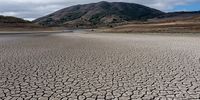 A cracked lake bed at Nicasio Reservoir during a drought in Nicasio, California, U.S., on Wednesday, Oct. 13, 2021. Residents failed to significantly cut back their water consumption in July, California state officials announced, foreshadowing some difficult decisions for Governor Newsoms administration as an historic drought lingers into the fall. Photographer: David Paul Morris/Bloomberg via Getty Images