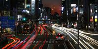 Rush hour traffic is seen passing a Tokyo 2020 promotional display in the Aoyama district of Tokyo on January 21, 2020 in Tokyo, Japan. (Photo by Clive Rose/Getty Images)