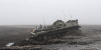 A damaged APC lies in a field north of Kyiv (Kiev), Ukraine, 02 April 2022 (made available on 03 April 2022). Some cities and villages surrounding the capital have recently been recaptured by the Ukrainian army from Russian forces.  EPA-EFE/STR