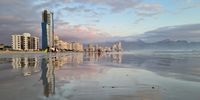 Early evening reflections on Melkbaai beach in the Strand. Photographer: Benhard Wiese