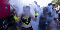  Ravers dance on and around Love Mobiles during the 22nd edition of the Lake Parade in Geneva, Switzerland, 20 July 2024.  EPA-EFE/SALVATORE DI NOLFI