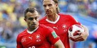 Swiss players Xherdan Shaqiri (L) and Michael Lang (R) react during the FIFA World Cup 2018 round of 16 soccer match between Sweden and Switzerland in St.Petersburg, Russia, 03 July 2018. EPA-EFE/ETIENNE LAURENT