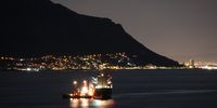 The Russian cargo ship Lady R is brought into Simon’s Town Naval Base by two SA Navy tugboats on Tuesday night, 6 December 2022. (Photo: Hugo Attfield)
