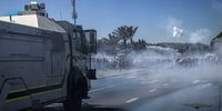 Police made use of water canons, tear gas and stun grenades to disperse EFF supporters as they tried to make their way to the school.<br>Photo / Shiraaz Mohamed.