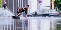 A wakeboarder on a flooded street in Klagenfurt, Austria, 06 August 2023. South-east Austria's Styria region has been placed on high alert as the area is hit by flash floods and mudslides after heavy rains on 04 August, while it's neighbouring country of Slovenia is facing the biggest natural disaster in its history due to flash floods following heavy torrential rains.  EPA-EFE/MAX SLOVENCIK