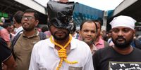 A school teacher roped himself to perform a mock suicide during a mass protest march to the Chief Minister’s office in Howrah, Eastern India, 14 July 2025. The protest involved school teachers who lost their jobs following a court order over allegations of irregularities.  EPA/PIYAL ADHIKARY
