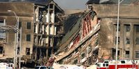  A 200-foot gash exposes interior sections of the Pentagon following a suspected terrorist crash of a hijacked commercial airliner into the Pentagon September 11, 2001 in Arlington, VA. The attack came at approximately 9:40 a.m. as the plane, originating from Washington D.C.''s Dulles airport, was flown into the southern side of the building. (Photo by Bob Houlihan/U.S. Navy/Getty Images)