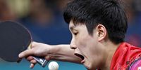 Tomokazu Harimoto of Japan in action against Fan Zhendong of China during their Men Singles Quartfinal match of the Table Tennis competitions in the Paris 2024 Olympic Games, at The South Paris Arena in Paris, France, 01 August 2024.  EPA-EFE/YOAN VALAT