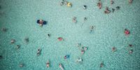 SIRACUSA, ITALY - AUGUST 15: The sea of Fontane Bianche crowded by bathers in an aerial view from the helicopter of the Coast Guard on the day of Ferragosto, within the operation "safe sea" on August 15, 2021 in SIRACUSA Italy. Earlier this week, Sicily saw temperatures reach 48.8C (119.8F), the highest seen by the European continent in recent history. The heatwave has swept across the Mediterranean, causing wildfires in Italy, Greece and Turkey.   (Photo by Fabrizio Villa/Getty Images)