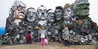 epa09260277 Members of the public visit the 'Mount Recyclemore' sculpture depicting G7 leaders (L-R) Boris Johnson, Yoshihide Suga, Emmanuel Macron, Mario Draghi, Justin Trudeau, Angela Merkel and Joe Biden at Sandy Acres, St Ives, Cornwall, Britain, 10 June 2021. Artist Joe Rush has created sculptures of the G7 leaders inspired by Mount Rushmore. The artwork is made from discarded electronics illustrating the growing problem of e-waste. Britain is hosting the G7 summit in Cornwall from 11 to 13 June 2021.  EPA-EFE/JON ROWLEY