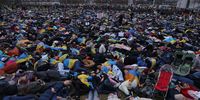 BERLIN, GERMANY - APRIL 06: Protesters, most of them Ukrainians and many of them refugees, lie down during a demonstration to symbolise the murdered civilians of the current Russian war in Ukraine as the Chancellery stands behind on April 06, 2022 in Berlin, Germany. Protest leaders called for a full embargo against Russia and an end to civilian deaths in the war. Meanwhile the numbers of confirmed civilian dead in towns north of Kyiv like Bucha, Irpin and Hostomel are continuing to rise in the wake of the Russian military retreat following their occupation of the area. (Photo by Sean Gallup/Getty Images)