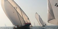 epa09247003 Dhow boats compete in the Al Gaffal Dhow Race outside Dubai, United Arab Emirates, 04 June 2021. Al Gaffal long distance Sur Bin Na'air 60ft Traditional Dhow Race (Dhow is a traditional boat) in Dubai is the biggest traditional sailing race in the world. 106 boats take part in the race which starts from Sur Bu Na'air Island to Dubai Eye at Bluewaters Island  EPA-EFE/ALI HAIDER