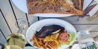 A simple meal in Jumièges – boudin (blood sausage) and buckwheat-flour pancake filled with local Camembert. (Photo: Marita van der Vyver)<br>