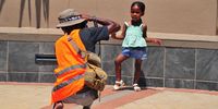 Young Kwetsimo Chabalala poses after a shopping outing with her mom. Shoppers take advantage of the presence of social photographers working at the mall to capture memories. (Photo: Lucas Ledwaba / Mukurukuru Media)