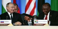 Russian President Vladimir Putin (L) laughs with South African President Cyril Ramaphosa (R) at the first plenary session as part of the 2019 Russia-Africa Summit at the Sirius Park of Science and Art in Sochi, Russia, 24 October 2019. The Russia-Africa Summit and Economic Forum take place on 23-24 October 2019.  EPA-EFE/SERGEI CHIRIKOV / POOL