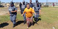 Racquel 'Kelly" Smit, mother of missing Joshlin, lead the pack to the home where Joshlin stayed and disappeared from.<br>(Photo: Vincent Cruywagen)