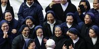 epaselect epa10375490 Pope Francis talks with nuns during the weekly General Audience in the Paul VI Audience Hall, in Vatican City, 21 December 2022.  EPA-EFE/FABIO FRUSTACI