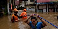 JAKARTA, INDONESIA - FEBRUARY 20: An Indonesian man walks through a flooded neighborhood on February 20, 2021 in Jakarta, Indonesia.  Severe flooding in numerous areas of the Indonesian capital forced over 1300 people to be evacuated from their homes on Saturday, while the country’s meteorology agency warned that the conditions were set to continue and possibly worsen over the next week. (Photo by Ed Wray/Getty Images) (Photo by Ed Wray/Getty Images)