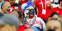  A supporter of Russia (C) cheers prior to the FIFA World Cup 2018 group A preliminary round soccer match between Saudi Arabia and Egypt in Volgograd, Russia, 25 June 2018. )  EPA-EFE/SERGEI ILNITSKY  