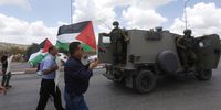 Palestinian protesters and Israeli soldiers during a demonstration  in the village of Hares near the northern West Bank city of Salfit on 19 June 2020 against Israel's plans to annex parts of the occupied West Bank. (Photo: EPA-EFE / Alaa Badarneh)