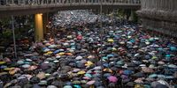 Thousands of anti-government protesters march on a street after leaving a rally in Victoria Park on August 18, 2019 in Hong Kong, China. Pro-democracy protesters have continued rallies on the streets of Hong Kong against a controversial extradition bill since 9 June as the city plunged into crisis after waves of demonstrations and several violent clashes. Hong Kong's Chief Executive Carrie Lam apologized for introducing the bill and declared it "dead", however protesters have continued to draw large crowds with demands for Lam's resignation and completely withdraw the bill.  (Photo by Chris McGrath/Getty Images)
