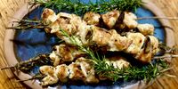 Espetada: cubes of chicken skewered on rosemary branches and grilled over hot coals. (Photo: Tony Jackman)<br>