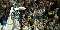 Floriane Issert, a Gendarmerie non-commissioned officer of the National Gendarmerie, carries the Olympic flag past athletes during the opening ceremony of the Paris 2024 Olympic Games on July 26, 2024 in Paris, France. (Photo by Loic Venance - Pool/Getty Images)