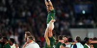 Cheslin Kolbe of South Africa is lifted by Eben Etzebeth of South Africa as they celebrate victory over England following the Rugby World Cup 2019 final in Japan. (Photo: Dan Mullan / Getty Images)