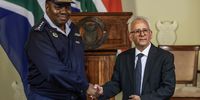 National Police Commissioner of South Africa, Fannie Masemola (L) shake hands with the newly appointed Minister of Police, Minister-Firoz Cachalia (R) following his  affirmation ceremony at Union Buildings on August 01, 2025 in Pretoria, South Africa. President Ramaphosa appointed Professor Cachalia as Acting Minister of Police after Minister Senzo Mchunu was placed on indefinite leave following corruption allegations made against him by the KwaZulu Natal Provincial Police Commissioner, Nhlanhla Mkhwanazi. (Photo by Gallo Images/Phill Magakoe)