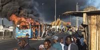 A MyCiti bus burns in Khayelitsha  during the taxi industry stay away on November 21, 2022 in Cape Town, South Africa. It is reported that law enforcement have been deployed to respond to the threatened public transport shutdown and taxi strike. (Photo by Gallo Images/Brenton Geach)