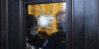 US Capitol police look from behind broken glass in the Capital rotunda door at the East Front of the US Capitol after pro-Trump protesters stormed the grounds leading to chaos, in Washington, DC, USA, 06 January 2021. Various groups of Trump supporters have broken into the US Capitol and rioted as Congress prepares to meet and certify the results of the 2020 US Presidential election.  EPA-EFE/MICHAEL REYNOLDS
