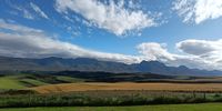 Uit die blou van onse hemel, Oor ons ewige gebergtes, Waar die kranse antwoord gee... Photographer: Guy Newcombe-Bond