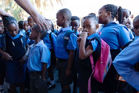 Emotional day as unplaced learners, flooding and overcrowding mar first day of school