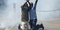 Protesters are surrounded by tear-gas during a protest in the central business district of Nairobi, Kenya, 12 June 2025. Police used tear gas on protesters demanding the resignation of Deputy Inspector General Eliud Lagat following the death of Kenyan blogger Albert Ojwang while in police custody. Ojwang, 31, was arrested along with several others following a complaint filed by the deputy inspector-general of police, Eliud Kipkoech Lagat, over posts on social media accusing him of corruption.  EPA-EFE/DANIEL IRUNGU