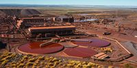 The iron ore processing plant stands at the Sishen open cast mine, operated by Kumba Iron Ore Ltd., an iron ore-producing unit of Anglo American Plc, in Sishen, South Africa, on Tuesday, May 22, 2018. (Photo: Waldo Swiegers/Bloomberg via Getty Images)