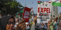 Protesters take part in a pro-Palestinian rally in Jakarta, Indonesia, 21 July 2024. Thousands of protesters staged a rally demanding the International Olympic Committee (IOC) to ban Israel from participating in the Olympics in solidarity with the Palestinian people.  EPA-EFE/MAST IRHAM