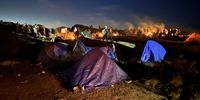 Migrant encampment on the night of a hard frost. Photographer: Ian Abramson
