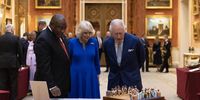 King Charles III and Camilla, Queen Consort show South African President Cyril Ramaphosa items, including a a chess set, which was a gift from President Mandela to the Duke of Edinburgh in 1996, displayed as part of the Royal Collection at Buckingham Palace on 22 November 2022 in London, England. This is the first state visit hosted by the UK with King Charles III as monarch, and the first state visit here by a South African leader since 2010. (Photo: Dan Kitwood - WPA Pool/Getty Images)