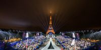 The Olympic flag is raised at the Place du Trocadero in front of the Eiffel Tower during the Opening Ceremony of the Olympic Games Paris 2024 on July 26, 2024 in Paris, France. (Photo by François-Xavier Marit-Pool/Getty Images)