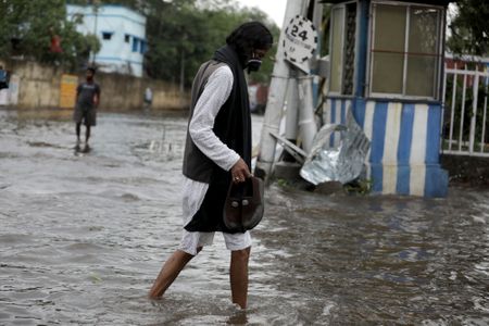 Indian PM visits cyclone stricken Kolkata promising help, Bangladesh counts cost